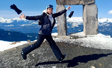 Photo of a woman hiking in the snow